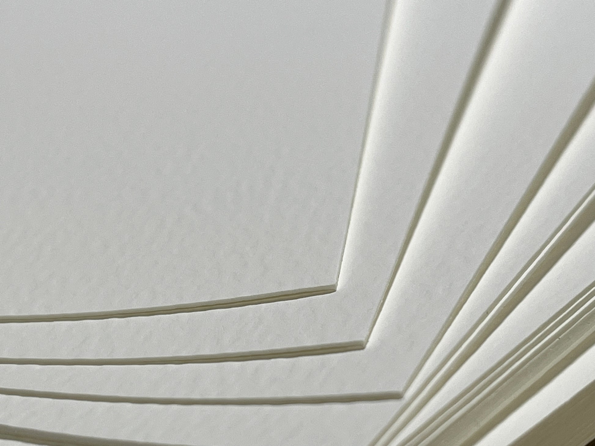 A close-up photo of pieces of cold press watercolor paper